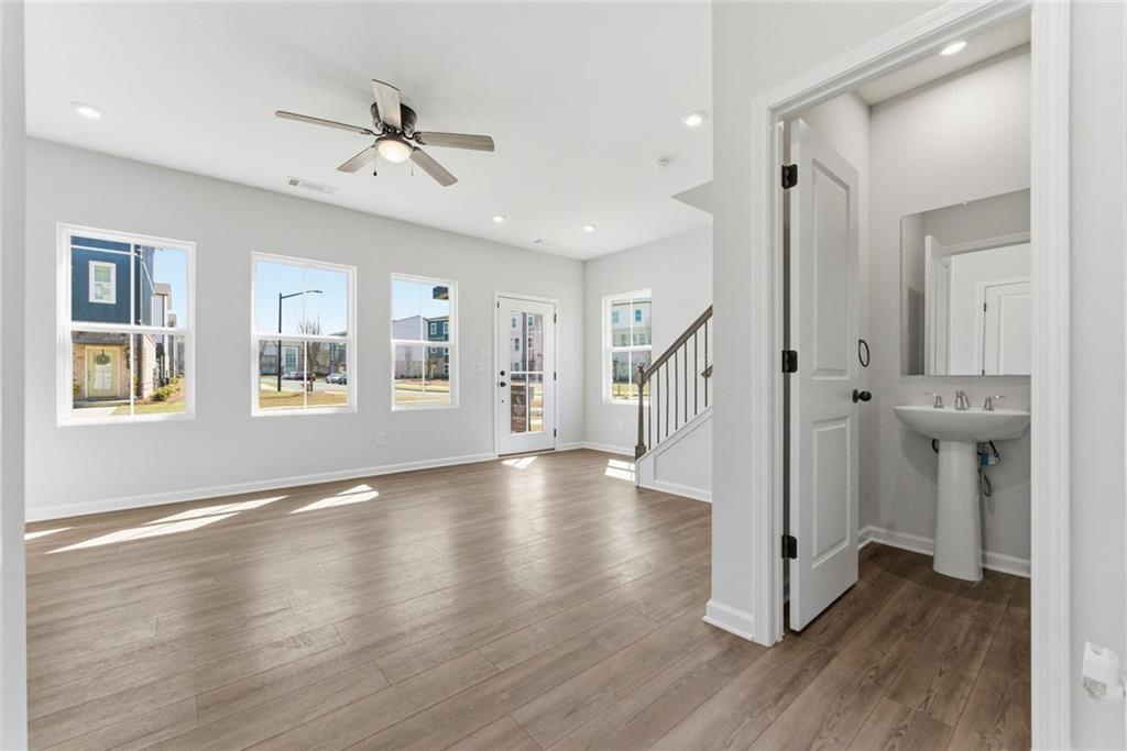 1200 Marlo Way Acworth, GA 30102 - Photo 6 of 34 a view of empty room with wooden floor and fan