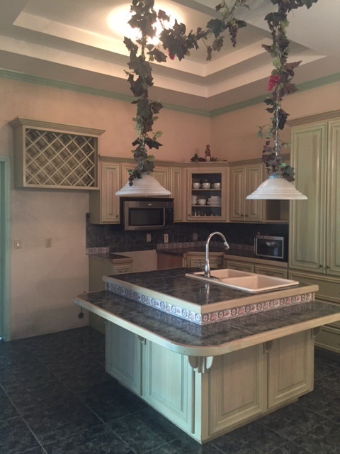 110 Tamarack Loop Laredo, TX 78045 - Photo 4 of 13 a kitchen with kitchen island granite countertop a sink cabinets and window