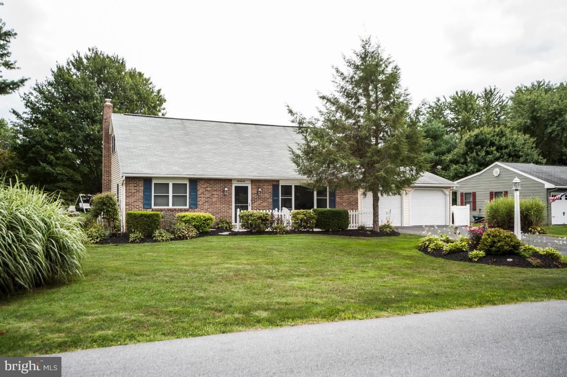 26 Buttonwood Drive Lititz, PA 17543 - Photo 1 of 39 a front view of a house with a garden and trees