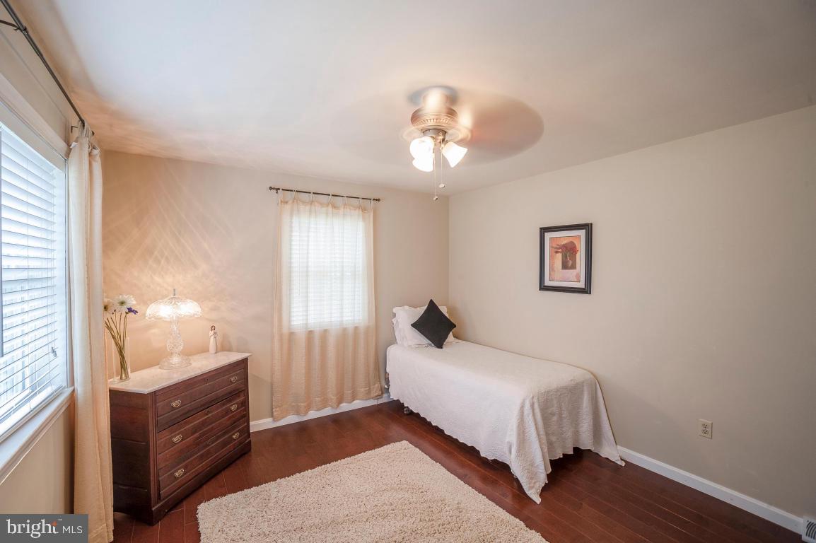 26 Buttonwood Drive Lititz, PA 17543 - Photo 8 of 39 a bedroom with a bed and a chandelier