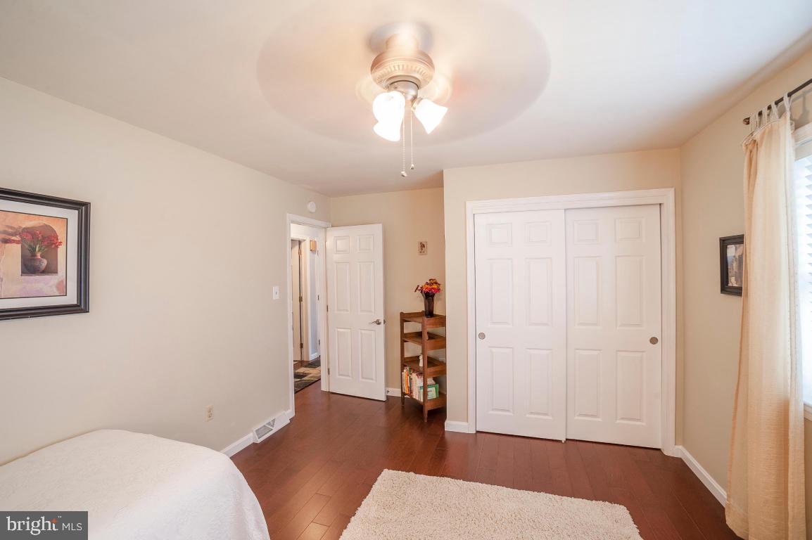 26 Buttonwood Drive Lititz, PA 17543 - Photo 9 of 39 a bedroom with a bed and a chandelier