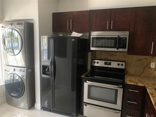 a kitchen with a stove and a microwave
