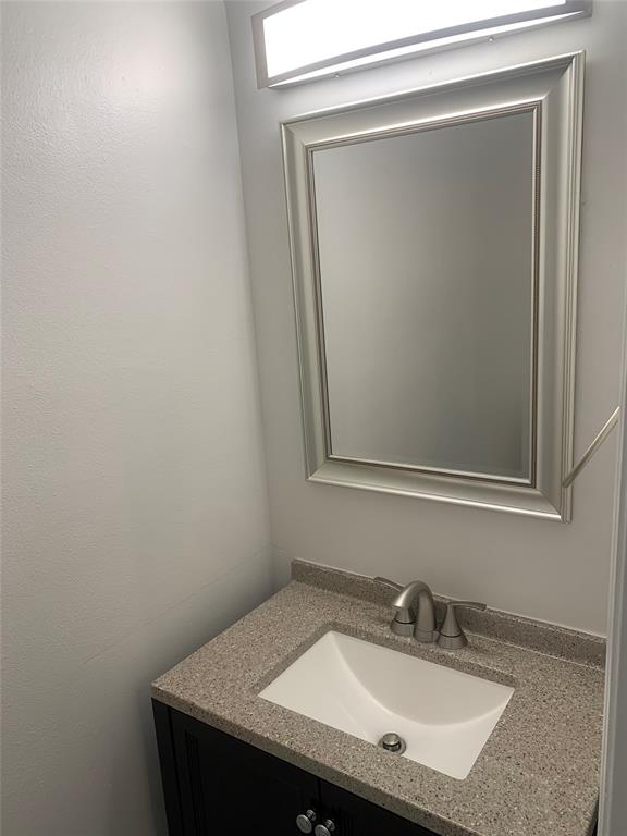 12017 Southwest 2nd Street, Unit 12017 Pembroke Pines, FL 33025 - Photo 4 of 13 a bathroom with a sink and a mirror