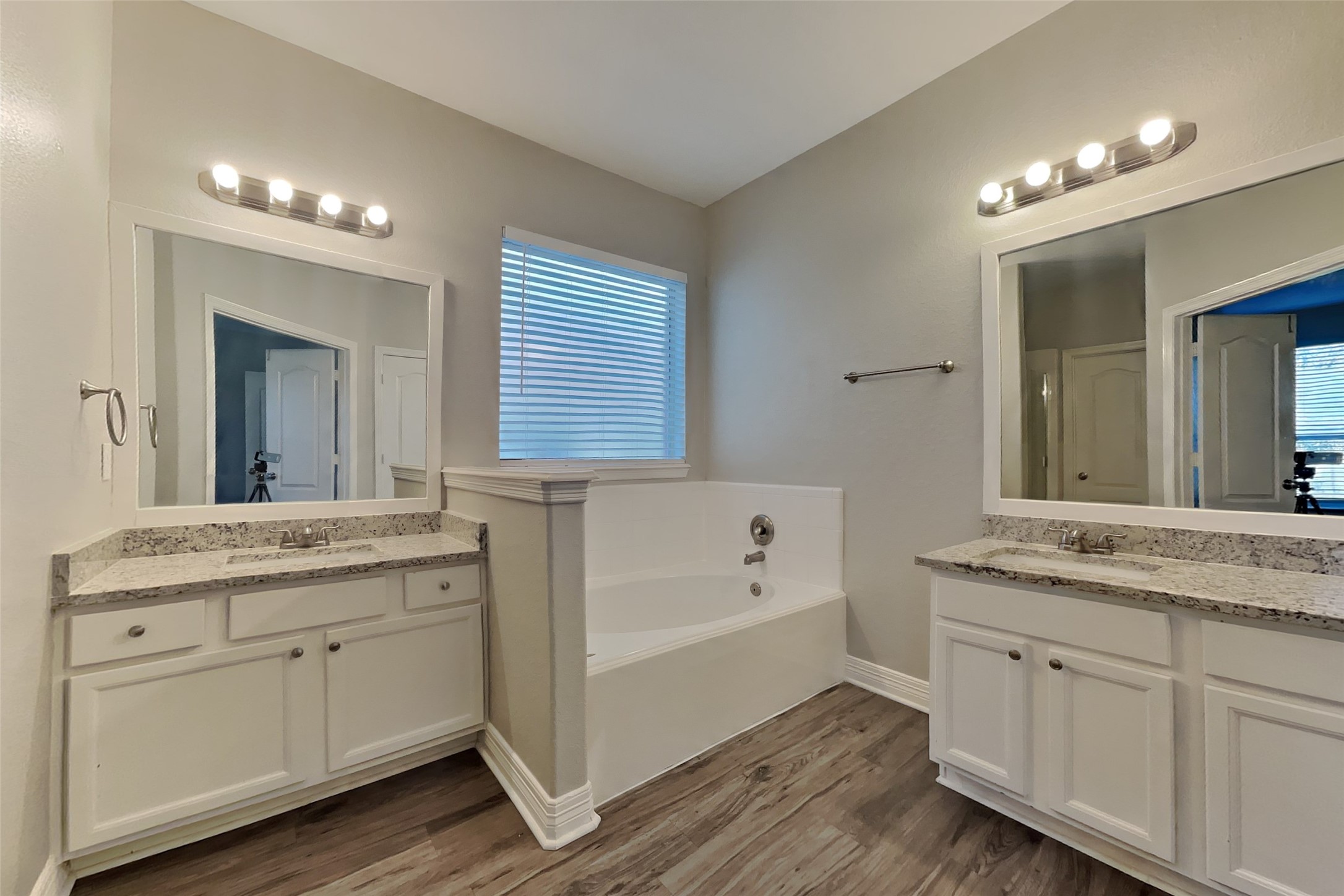 2815 Lockeridge Oaks Drive Spring, TX 77386 - Photo 11 of 18 a spacious bathroom with a granite countertop double vanity sink a mirror and a bathtub