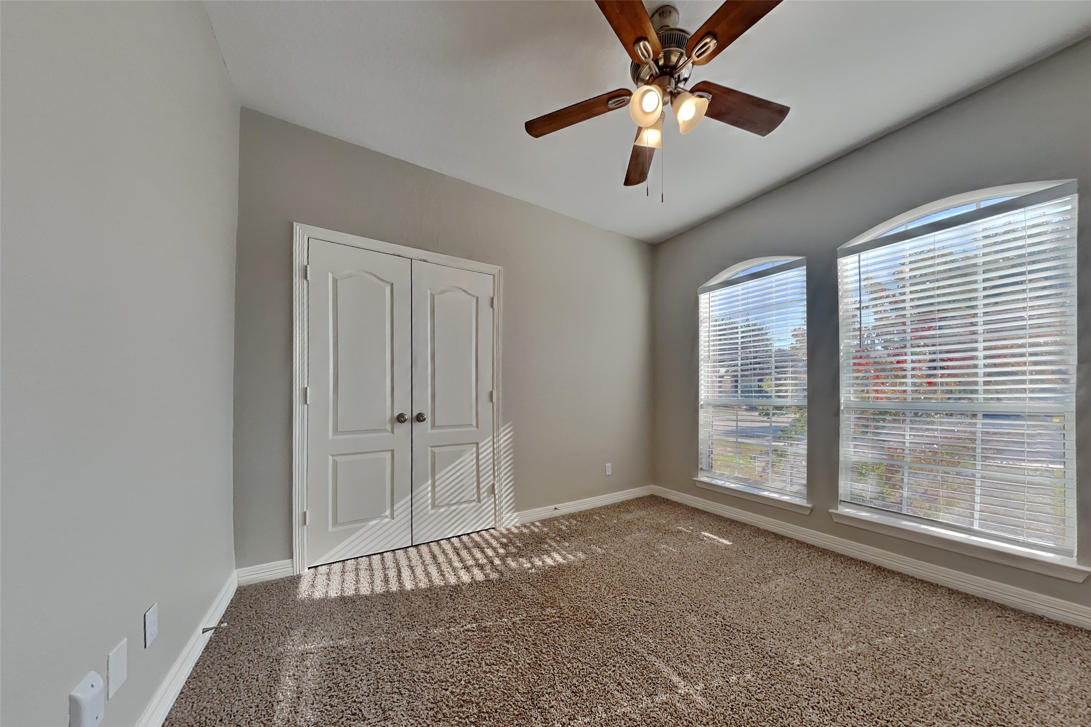 2815 Lockeridge Oaks Drive Spring, TX 77386 - Photo 12 of 18 a view of a livingroom with a ceiling fan and window