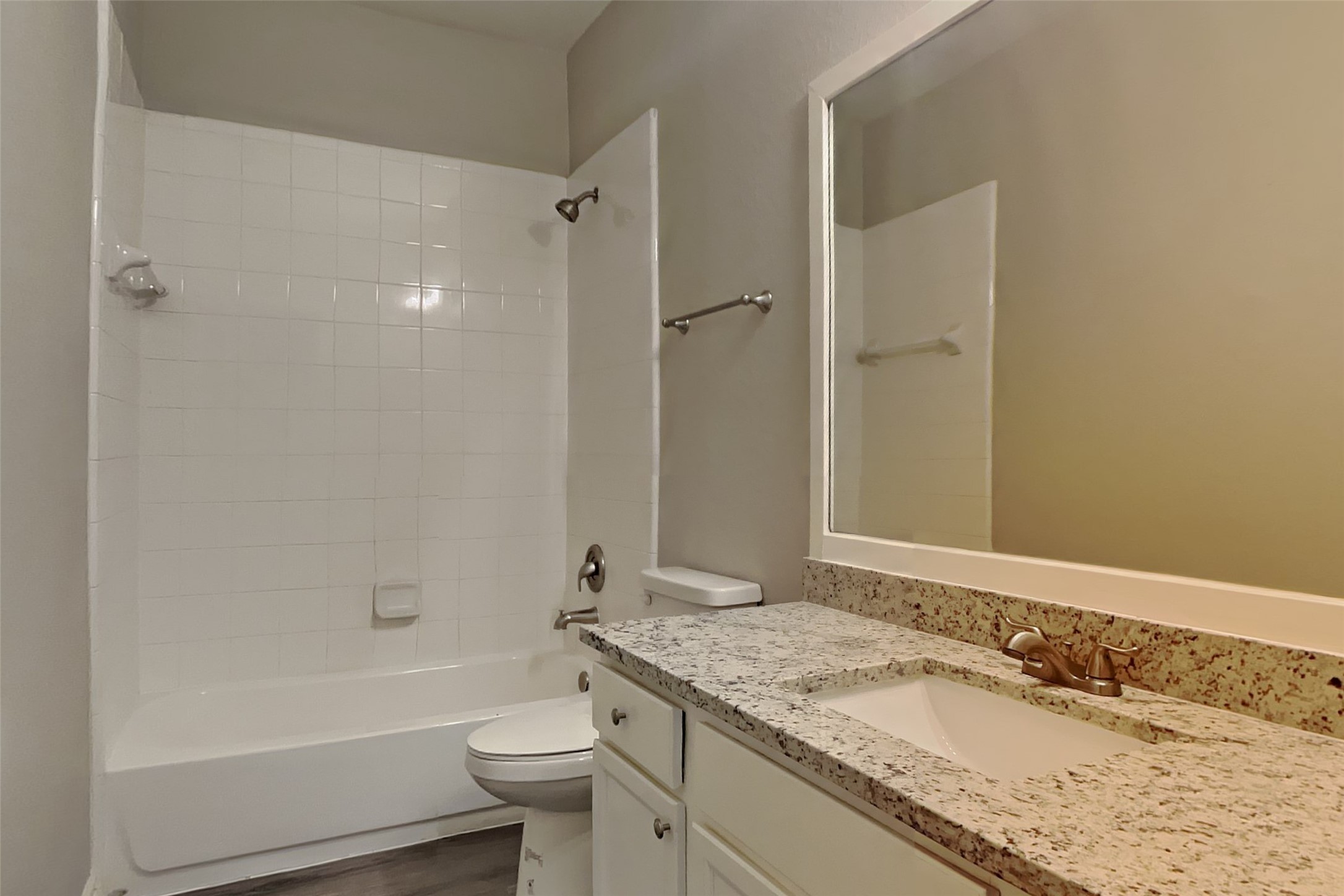 2815 Lockeridge Oaks Drive Spring, TX 77386 - Photo 15 of 18 a bathroom with a granite countertop sink a toilet and bathtub