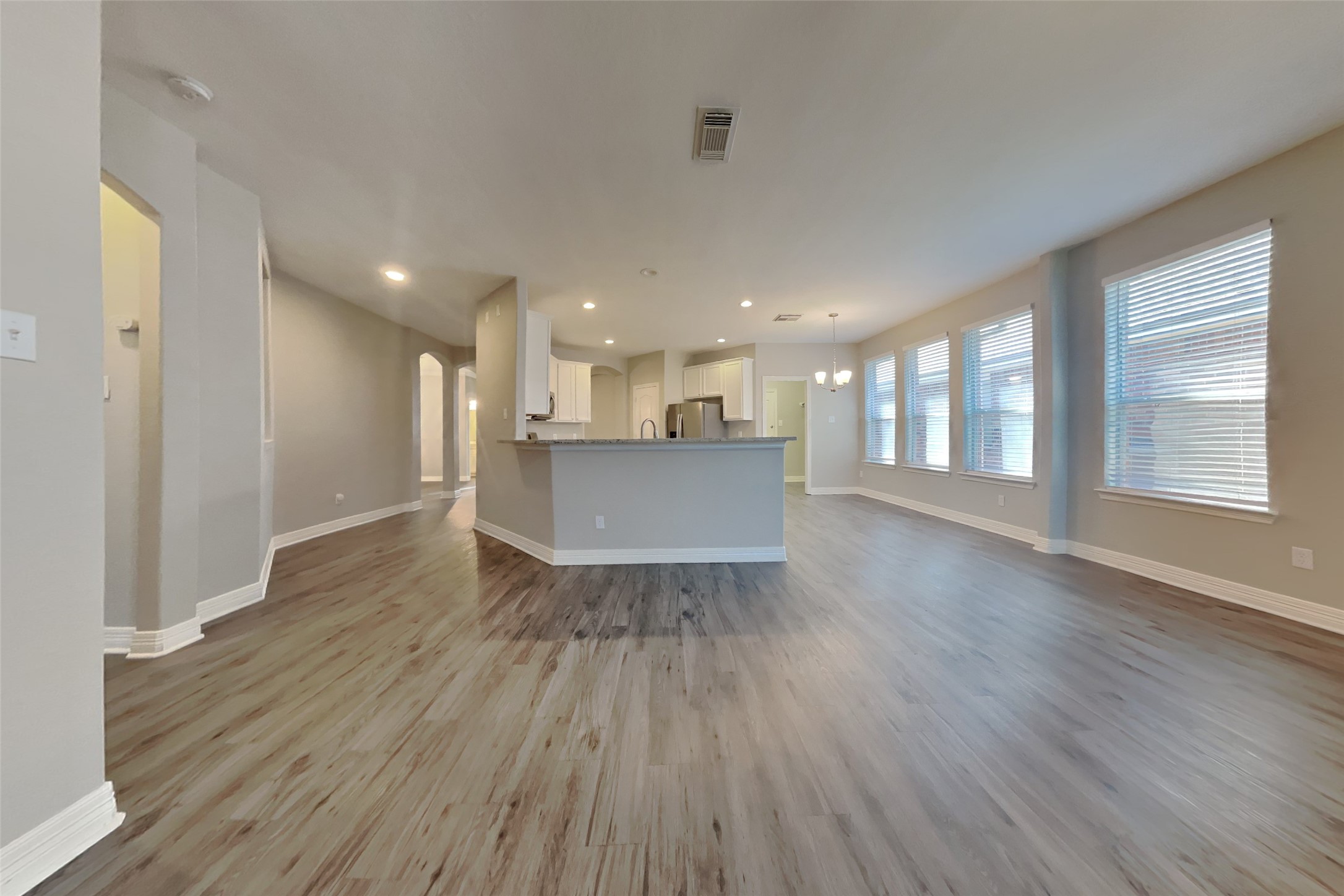 2815 Lockeridge Oaks Drive Spring, TX 77386 - Photo 3 of 18 a view of a big room with wooden floor and windows