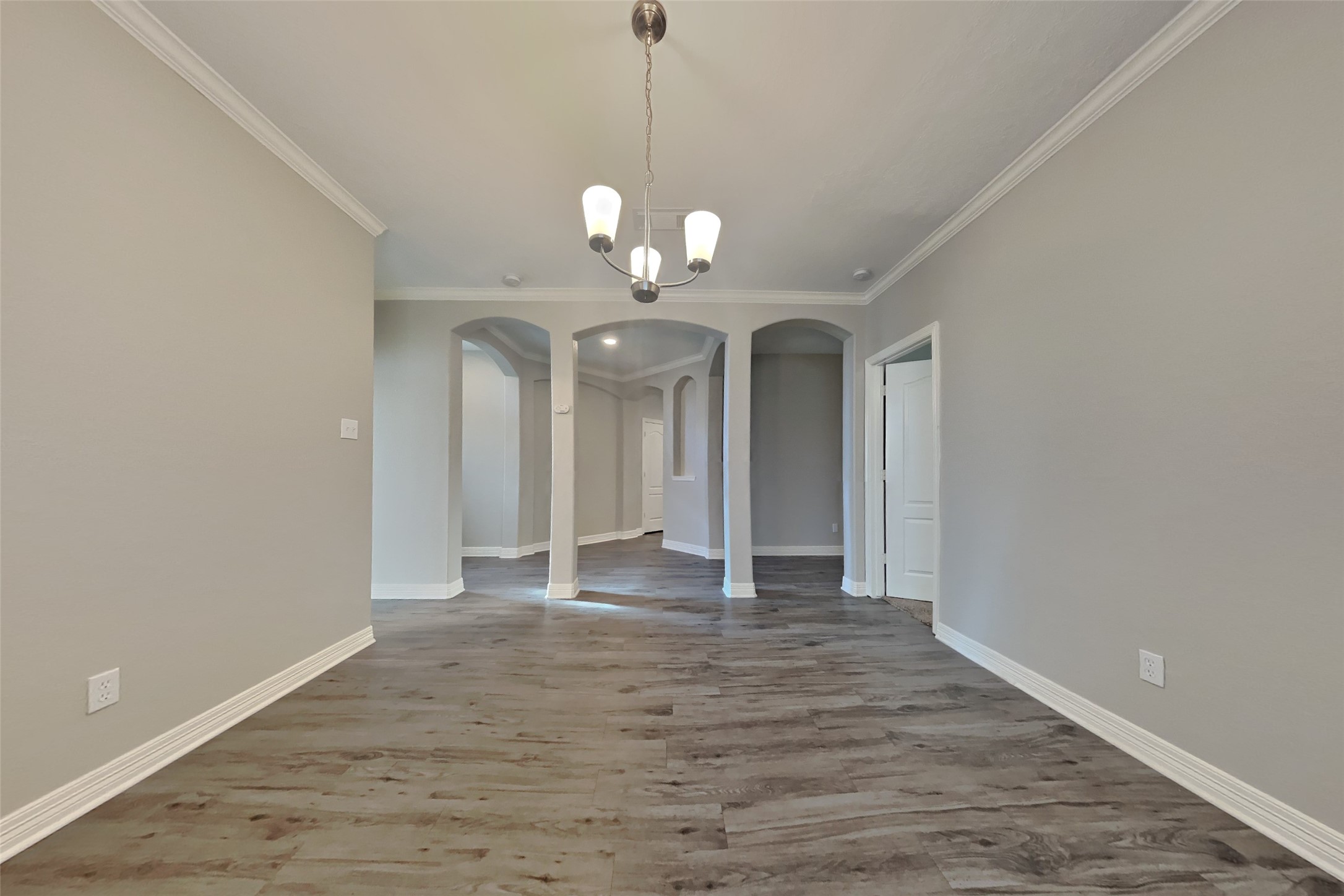 2815 Lockeridge Oaks Drive Spring, TX 77386 - Photo 8 of 18 a view of an empty room with wooden floor and a window