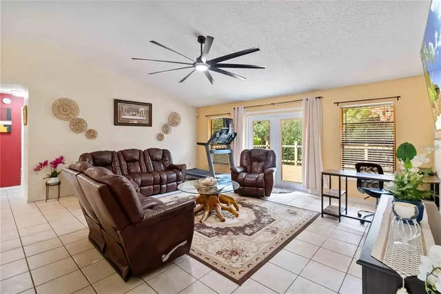 a living room with furniture and a window