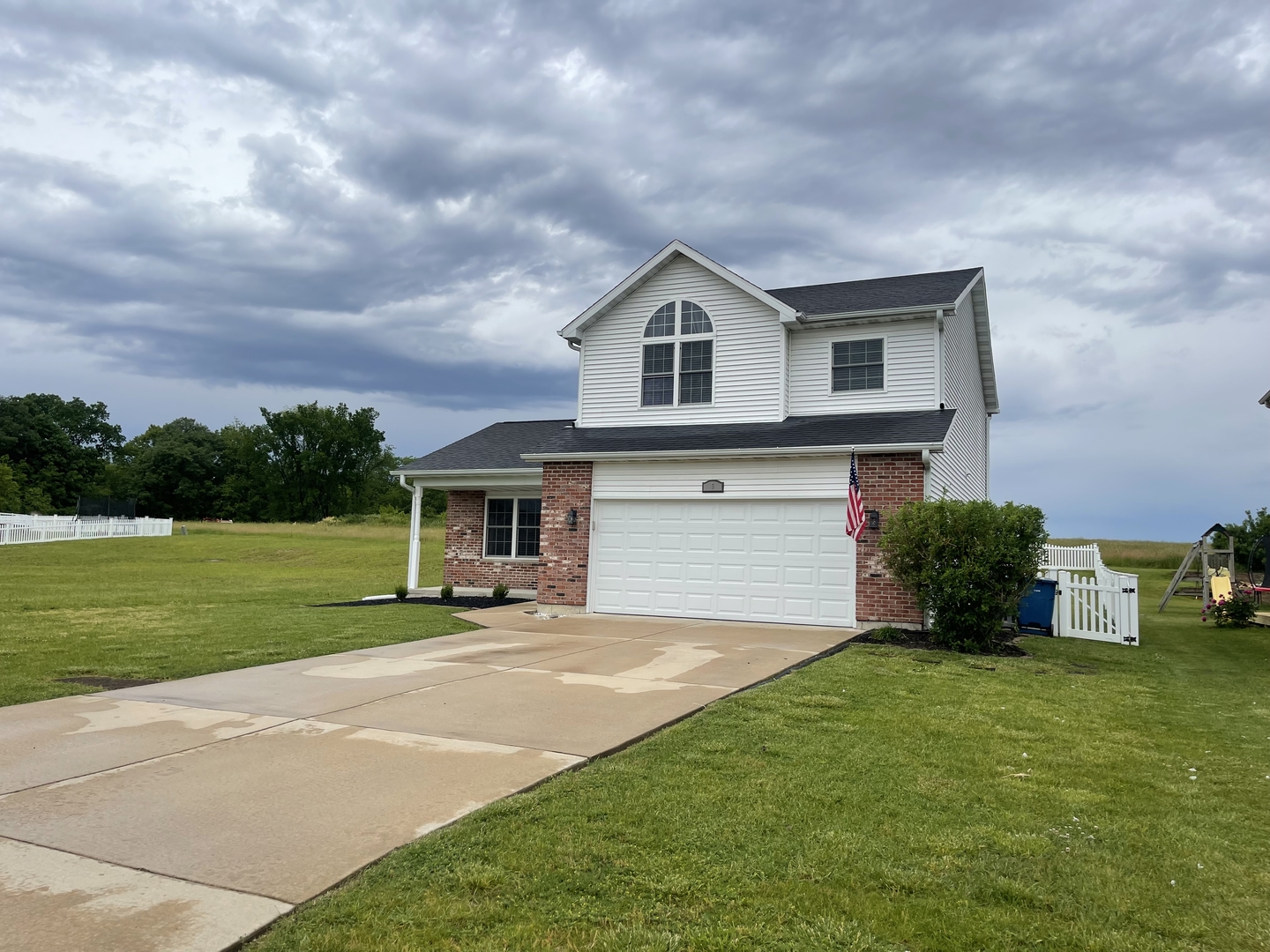 6 Emily Drive Spring Valley, IL 61362 - Photo 2 of 25 a front view of a house with a yard and garage