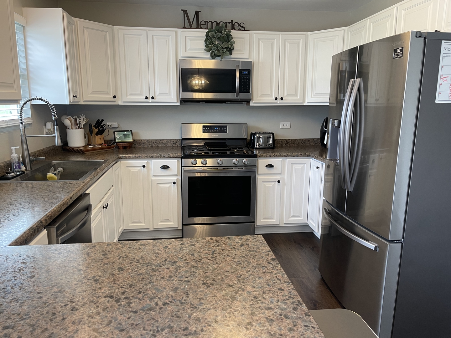 6 Emily Drive Spring Valley, IL 61362 - Photo 8 of 25 a kitchen with stainless steel appliances granite countertop a refrigerator stove a sink and dishwasher