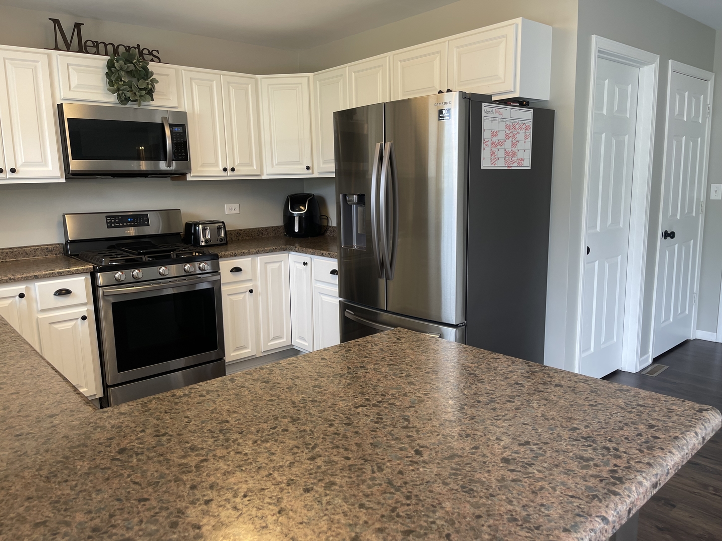 6 Emily Drive Spring Valley, IL 61362 - Photo 9 of 25 a kitchen with stainless steel appliances granite countertop a refrigerator stove and microwave