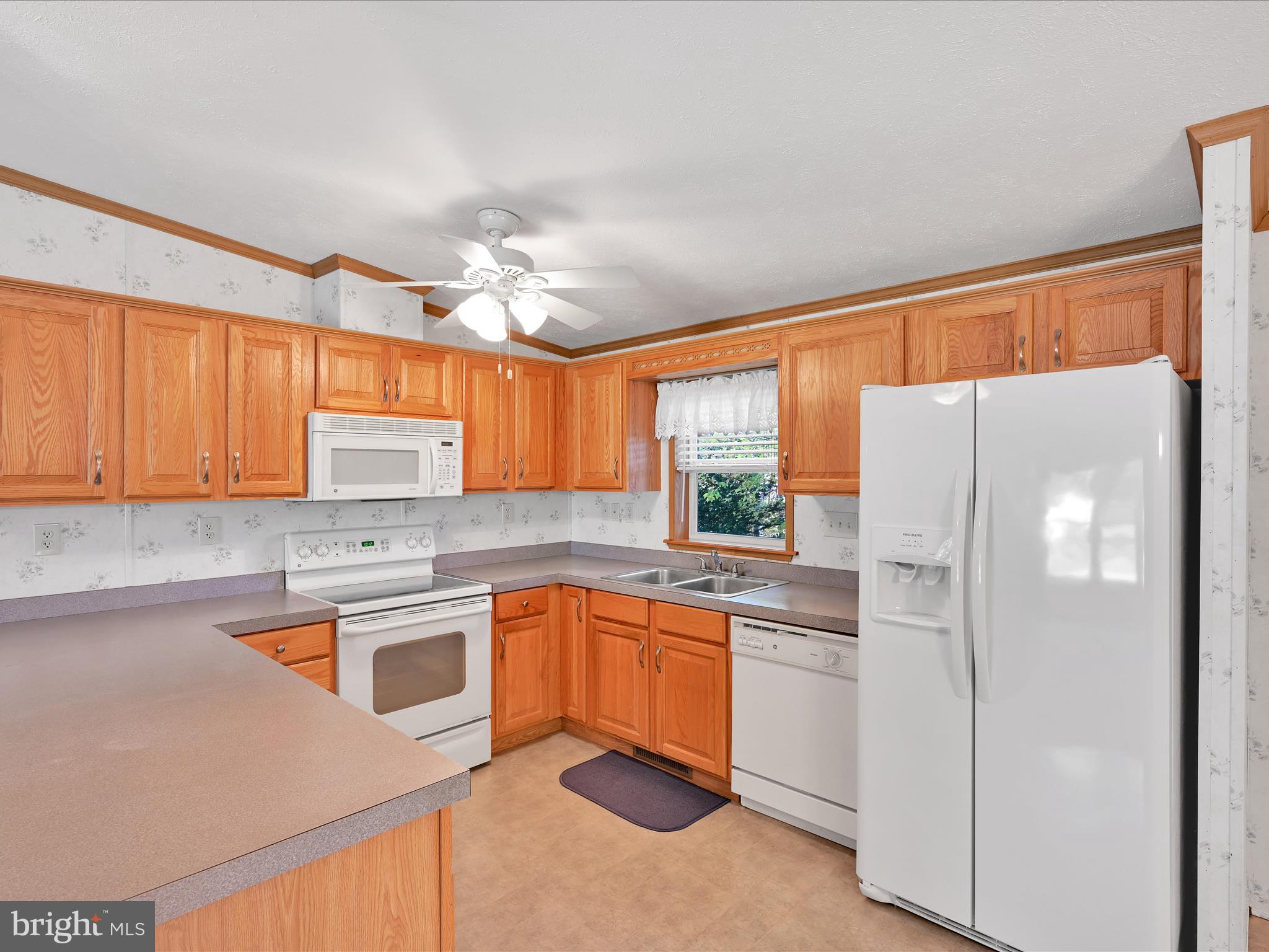 1044 Hemlock Circle Manheim, PA 17545 - Photo 13 of 31 a kitchen with white cabinets and white appliances