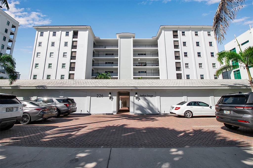 226 Golden Gate Point, Unit 21 Sarasota, FL 34236 - Photo 11 of 55 a car parked in front of a building