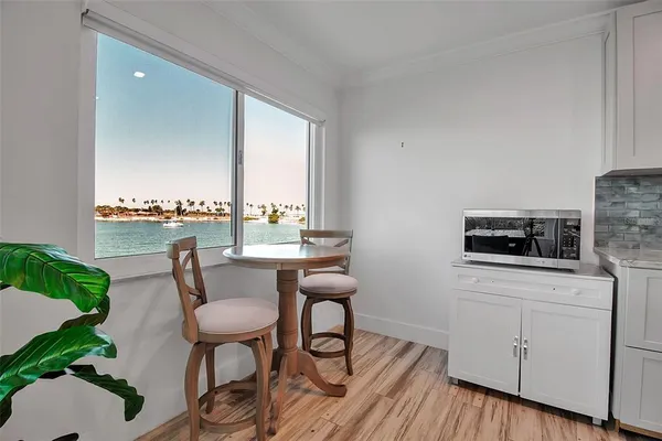 a dining room with furniture and wooden floor