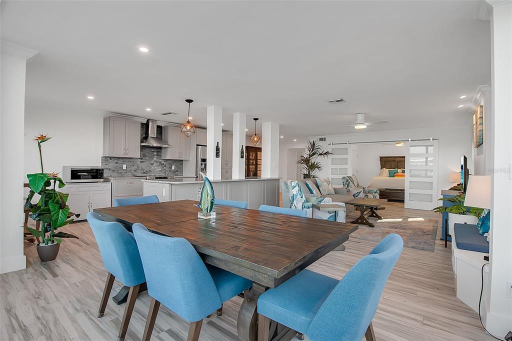 226 Golden Gate Point, Unit 21 Sarasota, FL 34236 - Photo 28 of 55 a view of a dining room with furniture and wooden floor