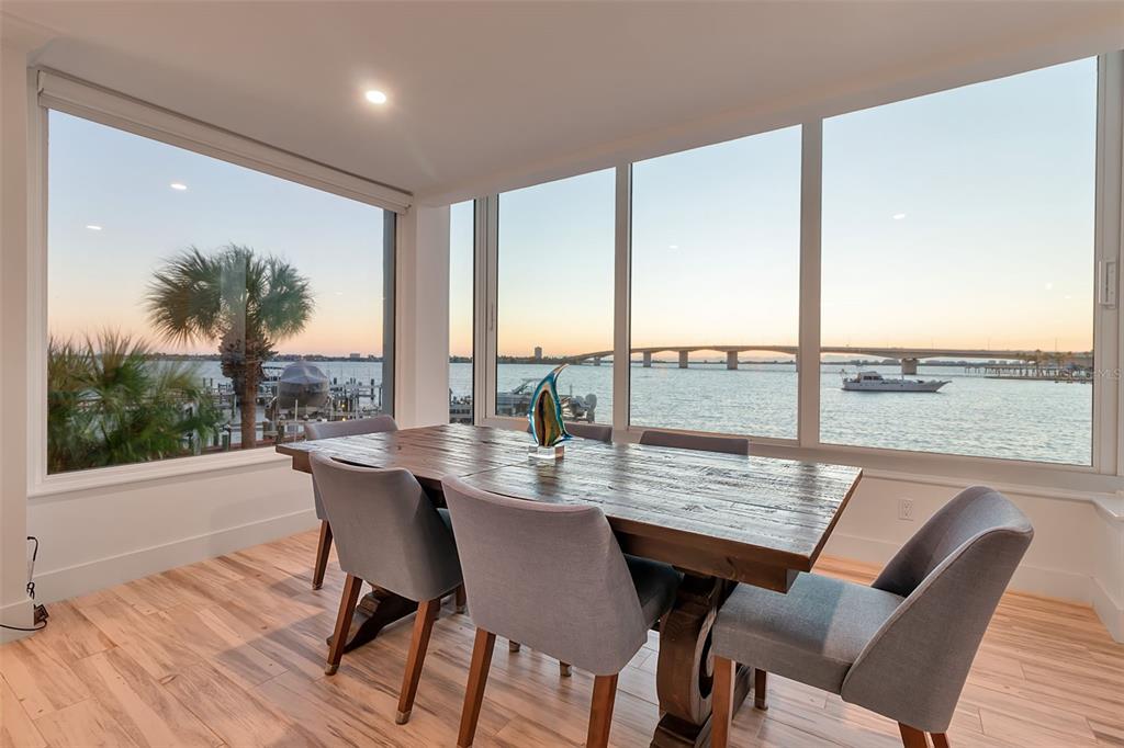 226 Golden Gate Point, Unit 21 Sarasota, FL 34236 - Photo 3 of 55 a dining room with furniture window and wooden floor