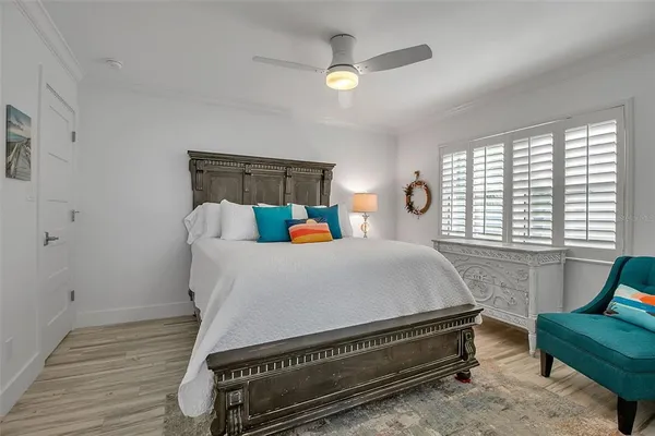 a living room with a bed furniture and a window