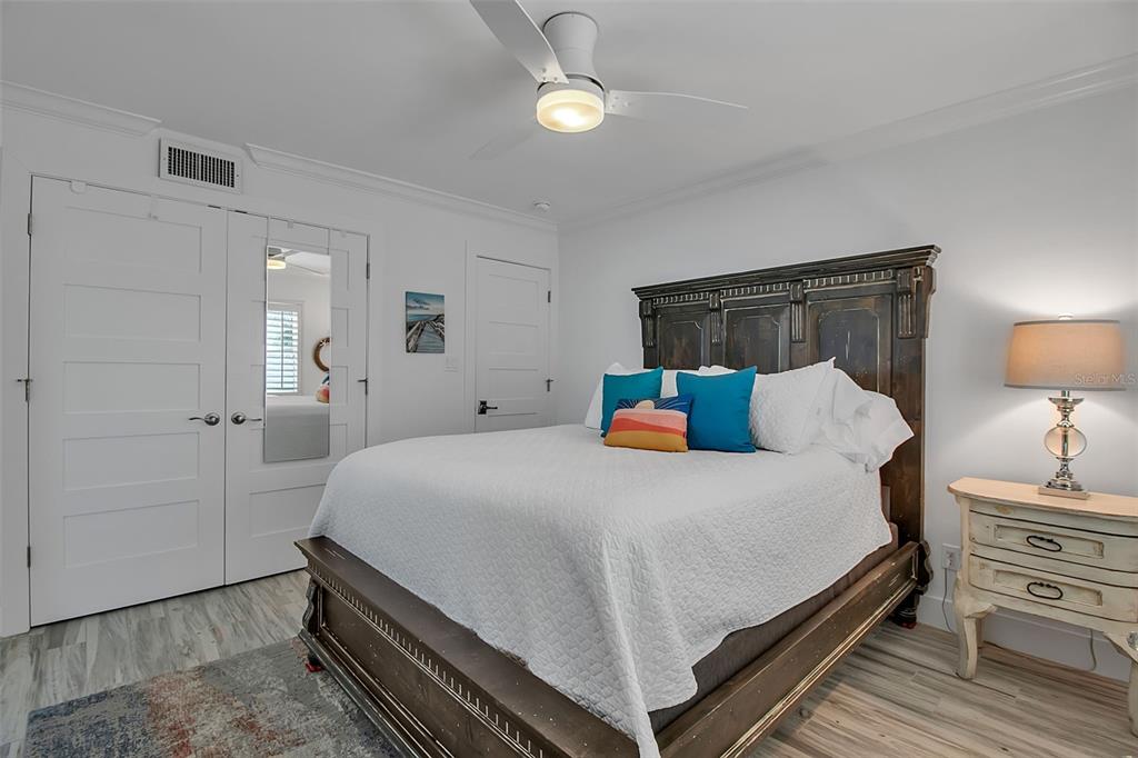 226 Golden Gate Point, Unit 21 Sarasota, FL 34236 - Photo 35 of 55 a bedroom with a bed and dresser