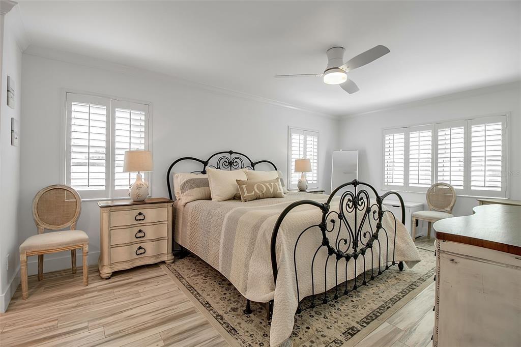 226 Golden Gate Point, Unit 21 Sarasota, FL 34236 - Photo 41 of 55 a bedroom with bed and a large window