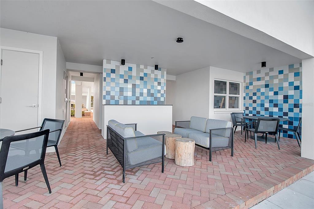 226 Golden Gate Point, Unit 21 Sarasota, FL 34236 - Photo 48 of 55 a living room with furniture and a dining table