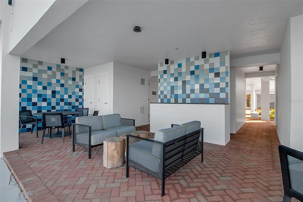 226 Golden Gate Point, Unit 21 Sarasota, FL 34236 - Photo 49 of 55 a living room with furniture and a table