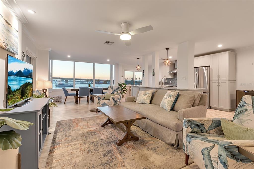 226 Golden Gate Point, Unit 21 Sarasota, FL 34236 - Photo 5 of 55 a living room with furniture and a flat screen tv