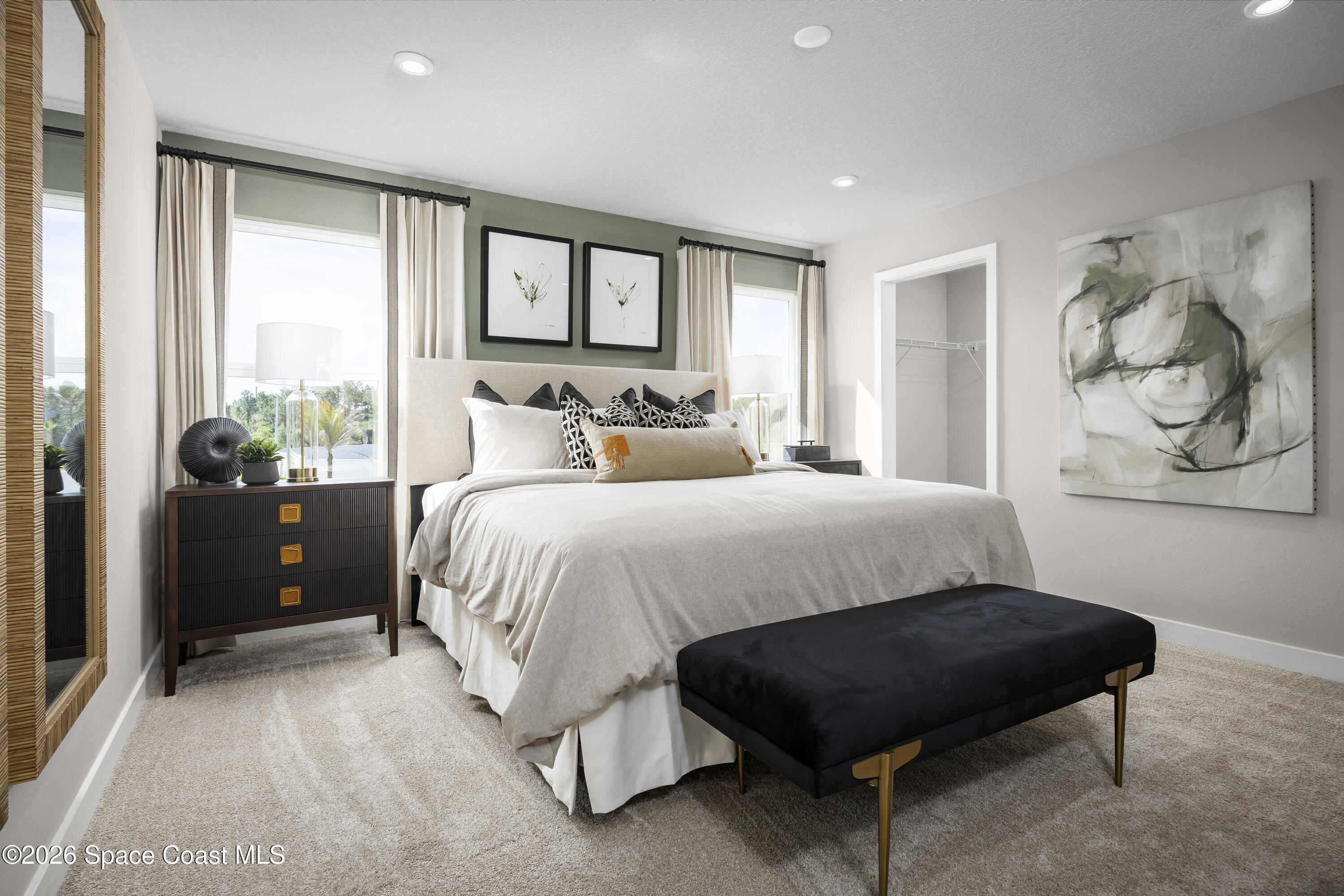 1878 Kendall Pointe Place Melbourne, FL 32935 - Photo 11 of 15 a spacious bedroom with a bed and window