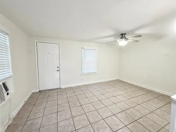 a view of an empty room and window