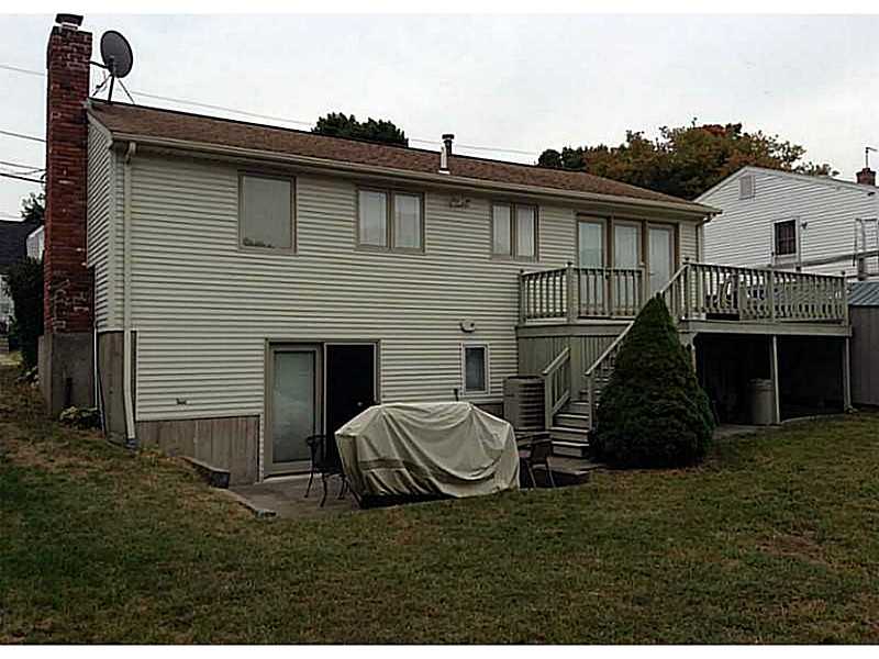 46 Oneida Street Pawtucket, RI 02860 - Photo 2 of 19 Exterior Back. Rear deck with basement walkout to patio.