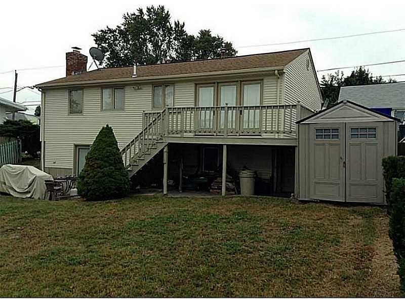 46 Oneida Street Pawtucket, RI 02860 - Photo 3 of 19 Exterior Back. Storage sheds to remain.