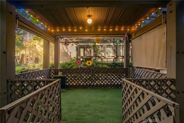 a view of a porch with wooden floor