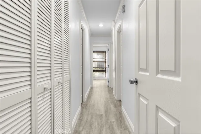 a bathroom with a granite countertop bathtub shower sink vanity and toilet