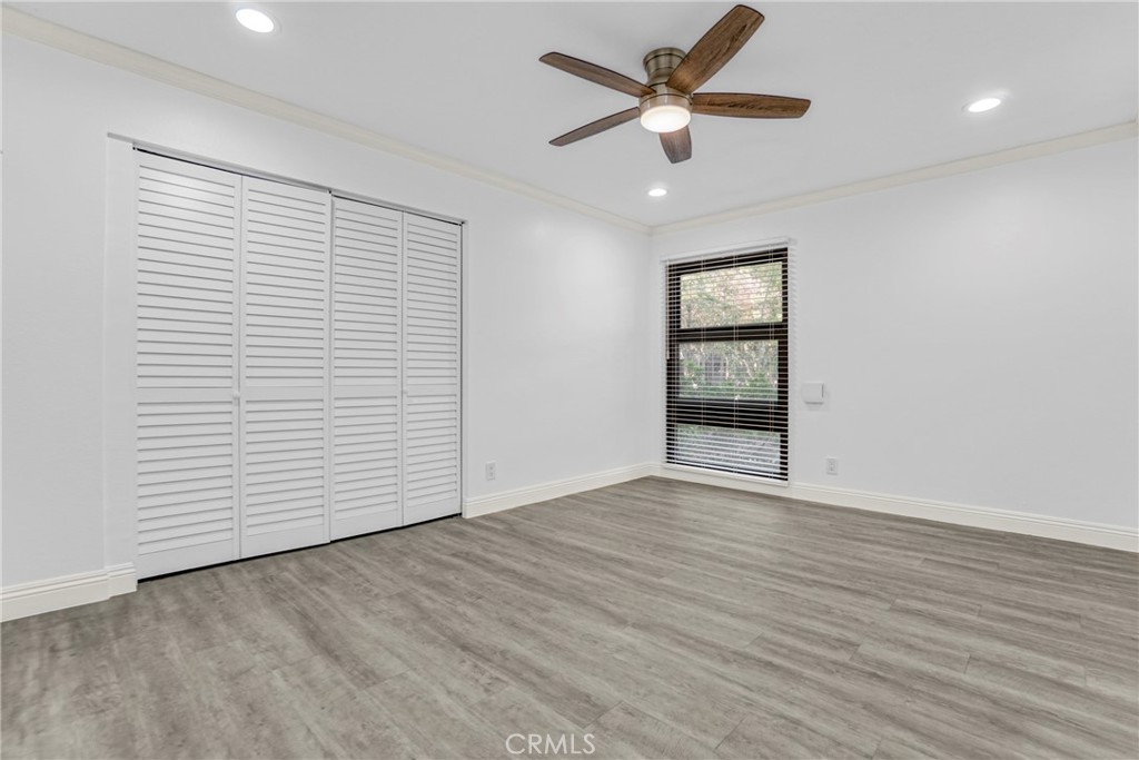 7765 West 91st Street, Unit F1113 Playa del Rey, CA 90293 - Photo 16 of 41 wooden floor in an empty room with a window