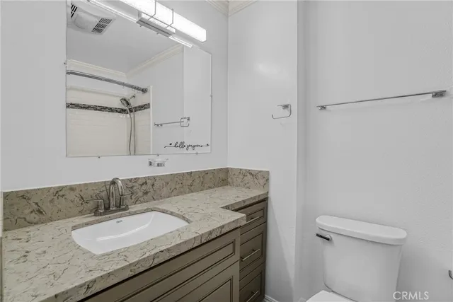 an empty room with closet and windows