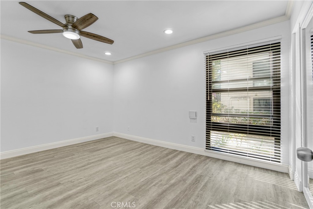 7765 West 91st Street, Unit F1113 Playa del Rey, CA 90293 - Photo 21 of 41 wooden floor in an empty room with a window