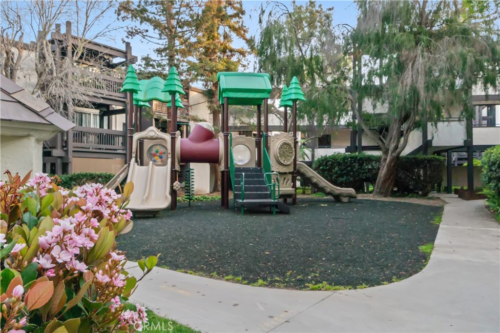 7765 West 91st Street, Unit F1113 Playa del Rey, CA 90293 - Photo 38 of 41 a view of a house with a garden