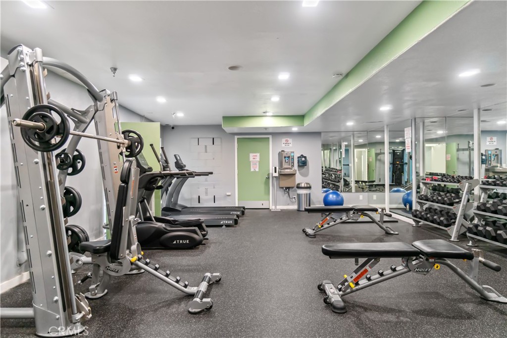 7765 West 91st Street, Unit F1113 Playa del Rey, CA 90293 - Photo 40 of 41 a room with gym equipment and windows