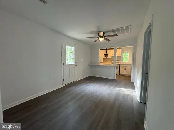 a kitchen with a refrigerator and a sink