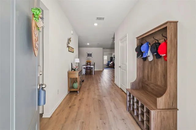 a view of entryway with wooden floor