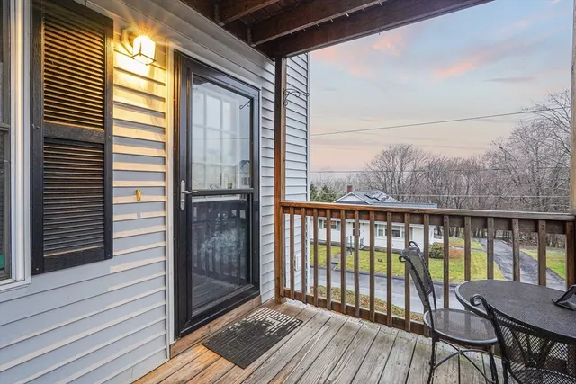 a view of a balcony with wooden floor