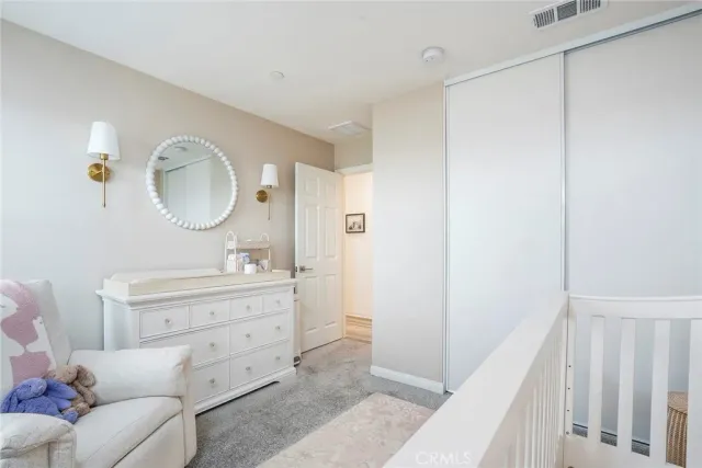 a spacious bathroom with a mirror a sink and a mirror