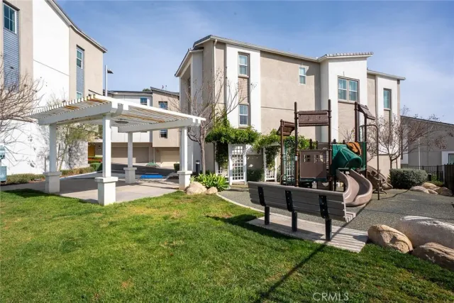 a view of a house with backyard porch and sitting area