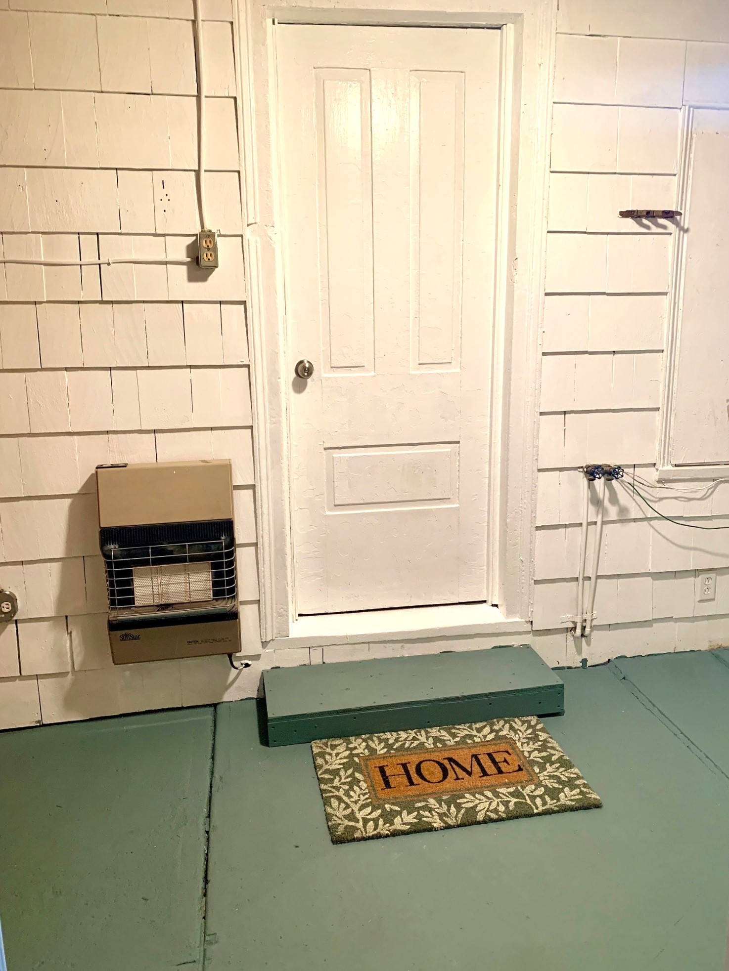 130 South Main Street Springboro, PA 16435 - Photo 20 of 29 Freshly painted Mudroom with wall mounted heater.