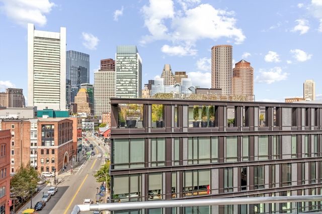a view of a large building with a roof deck
