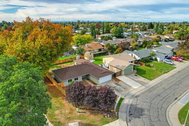 an aerial view of residential houses with outdoor space