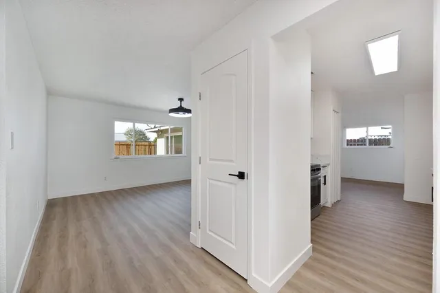 a view of room with wooden floor