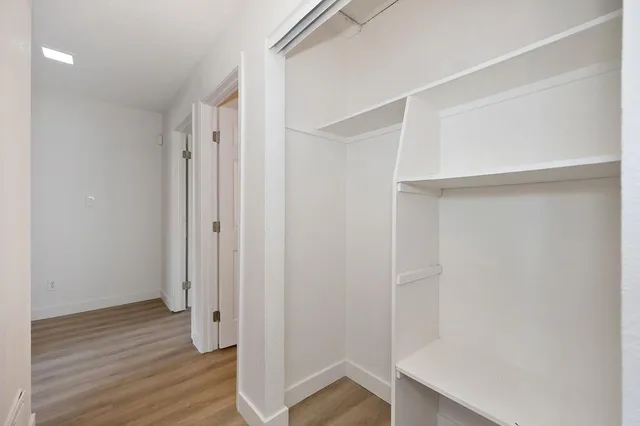 a kitchen with stainless steel appliances a sink stove and cabinets