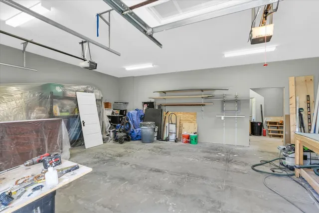 a view of a garage with rack and bicycle