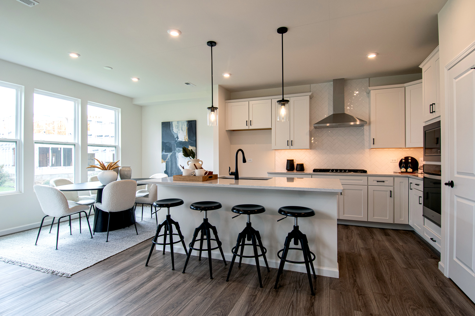 2244 Quartet Road Plainfield, IL 60585 - Photo 2 of 18 a kitchen with stainless steel appliances granite countertop a dining table chairs stove a refrigerator and cabinets